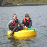 Boys on a buoy